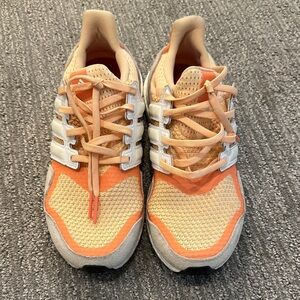 Women’s Adidas Ultraboost S&L running shoes in Glow Orange